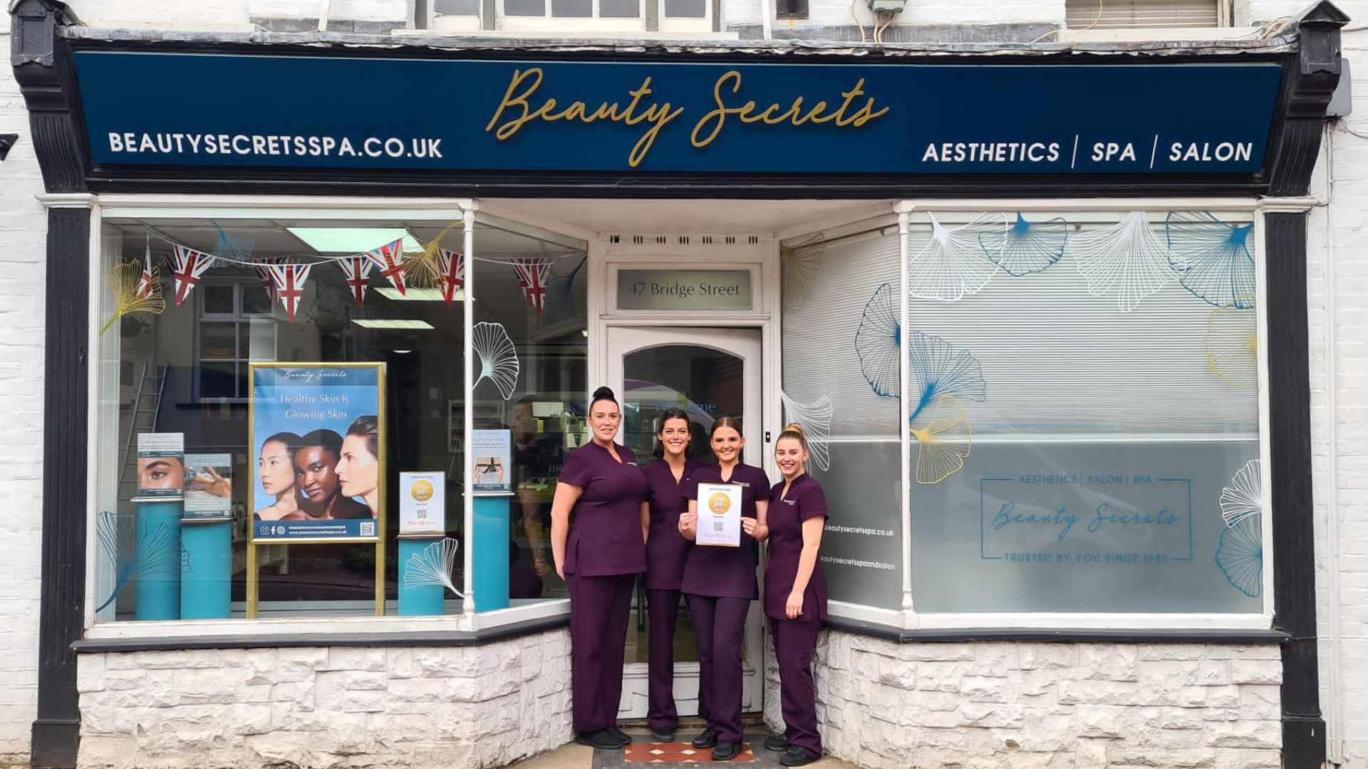 Beauty Salon in Godalming front windows with team. 